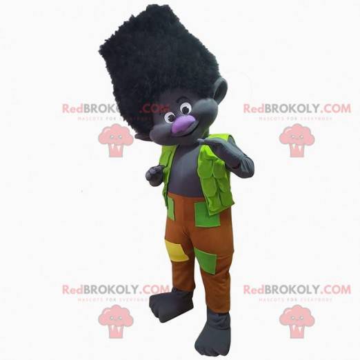 Mascote troll preto vestido com uma roupa colorida, criatura