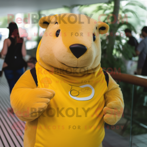 Yellow Capybara mascot costume character dressed with a T-Shirt and Wraps