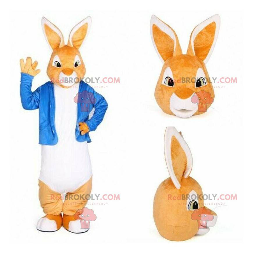 Mascotte de lapin orange et blanc avec une veste bleue -