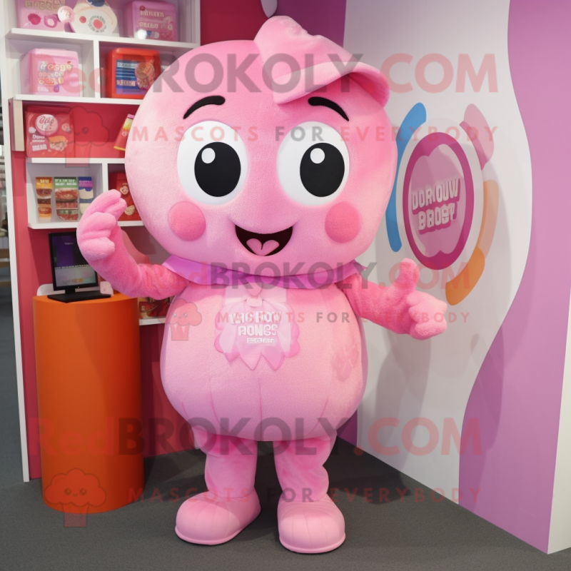 Pink Candy mascot costume character dressed with a Overalls and Clutch bags Pink Candy mascot costume character dressed with a Overalls and Clutch bags