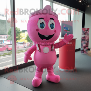 Pink Candy mascot costume character dressed with a Overalls and Clutch bags