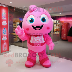 Pink Candy mascot costume character dressed with a Overalls and Clutch bags