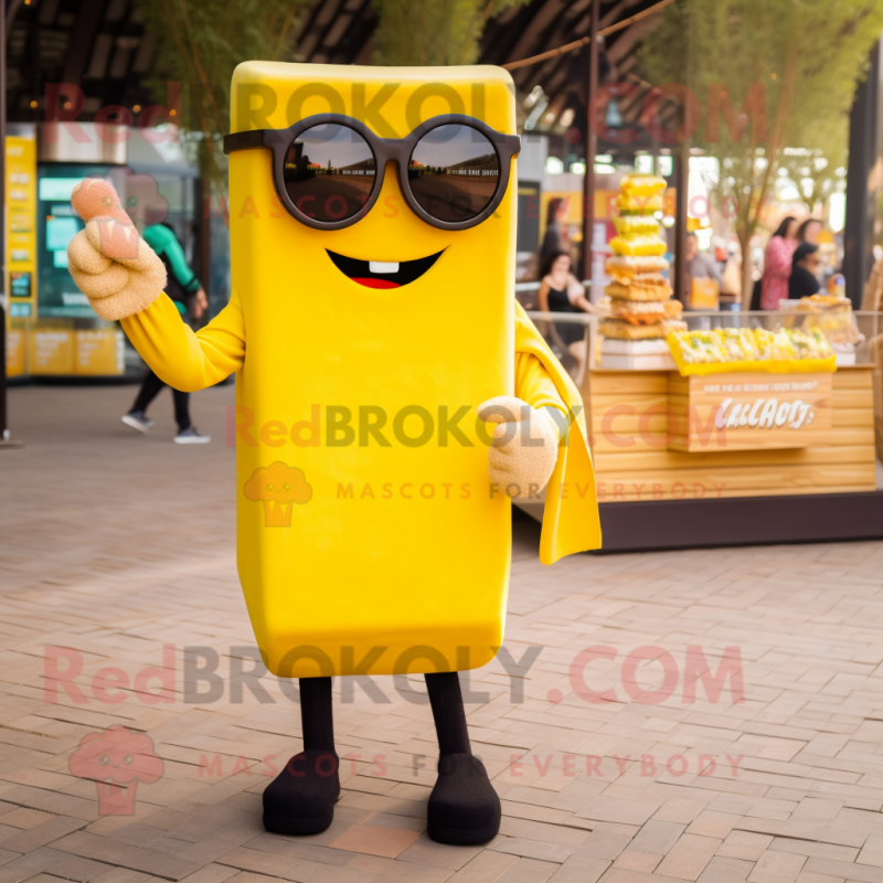 Yellow Chocolate Bars mascot costume character dressed with a Sweater and Sunglasses
