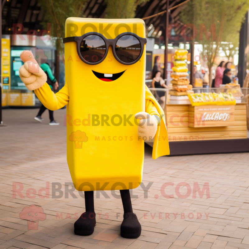 Yellow Chocolate Bars mascot costume character dressed with a Sweater and Sunglasses Yellow Chocolate Bars mascot costume character dressed with a Sweater and Sunglasses