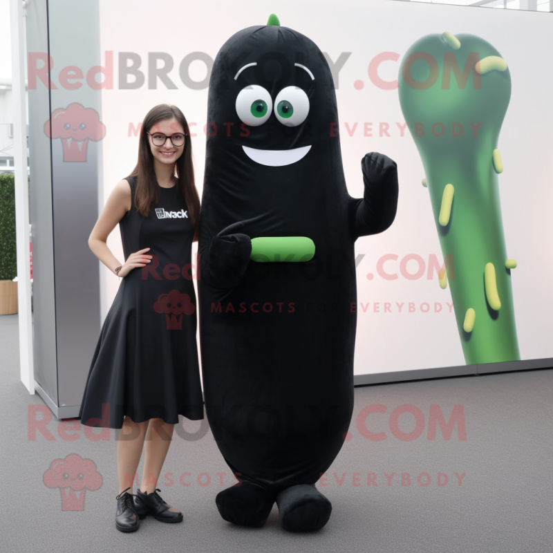 Black Zucchini mascot costume character dressed with a Sheath Dress and Ties Black Zucchini mascot costume character dressed with a Sheath Dress and Ties