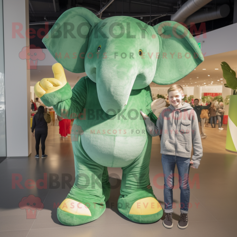 Green Elephant mascot costume character dressed with a Boyfriend Jeans and Mittens