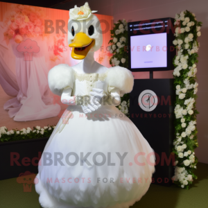 Cream Swans mascot costume character dressed with a Wedding Dress and Digital watches