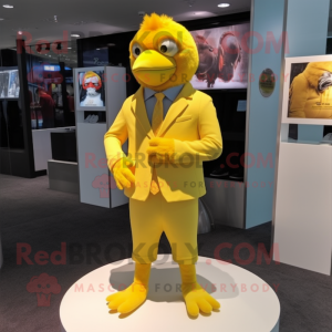 Yellow Canary mascot costume character dressed with a T-Shirt and Lapel pins