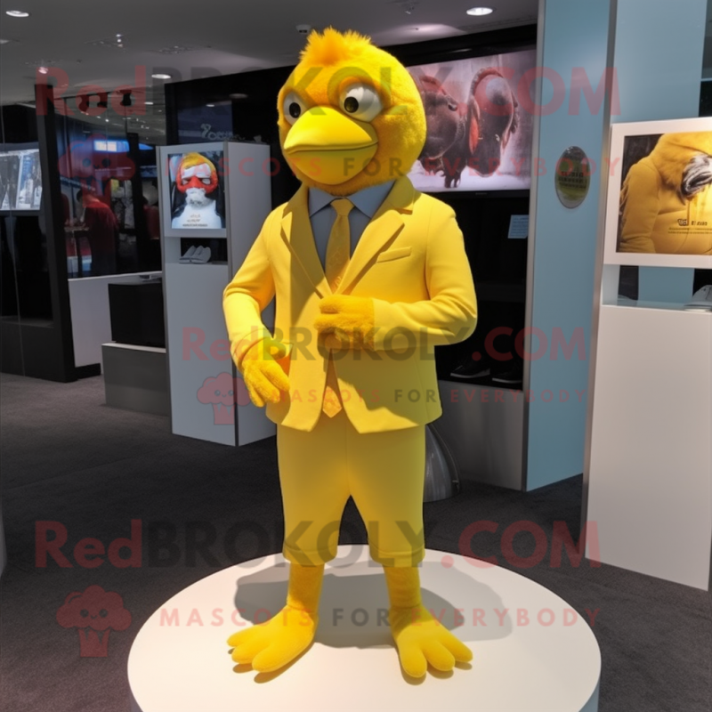 Yellow Canary mascot costume character dressed with a T-Shirt and Lapel pins Yellow Canary mascot costume character dressed with a T-Shirt and Lapel pins