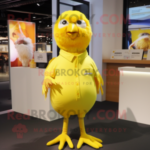 Yellow Canary mascot costume character dressed with a T-Shirt and Lapel pins
