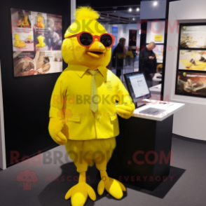 Yellow Canary mascot costume character dressed with a T-Shirt and Lapel pins