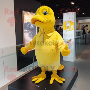 Yellow Pigeon mascot costume character dressed with a Long Sleeve Tee and Caps