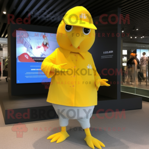 Yellow Pigeon mascot costume character dressed with a Long Sleeve Tee and Caps
