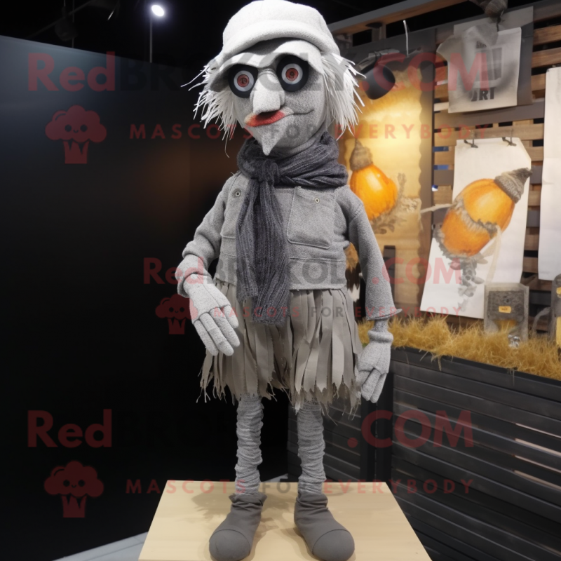 Gray Scarecrow mascot costume character dressed with a Shorts and Scarves