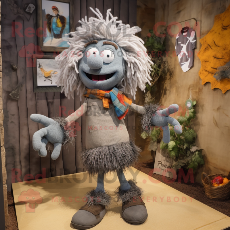 Gray Scarecrow mascot costume character dressed with a Shorts and Scarves