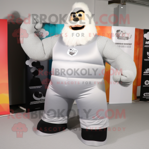 Silver Strongman mascot costume character dressed with a Maxi Dress and Mittens
