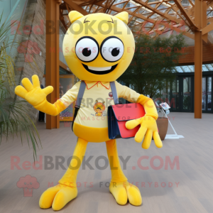 Yellow Spider mascot costume character dressed with a Oxford Shirt and Clutch bags