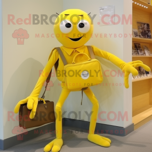 Yellow Spider mascot costume character dressed with a Oxford Shirt and Clutch bags
