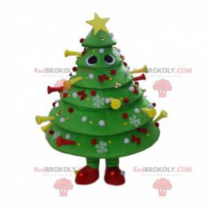 Maskot zdobený a slavnostní zelený strom, kostým vánoční