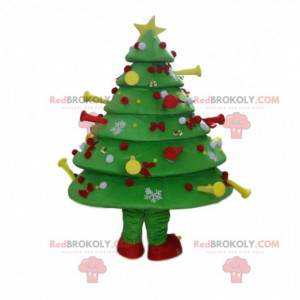 Maskot zdobený a slavnostní zelený strom, kostým vánoční