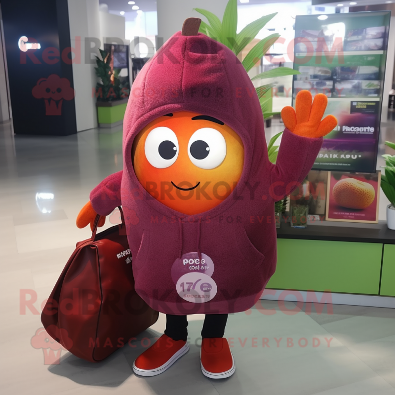 Maroon Grapefruit mascot costume character dressed with a Hoodie and Tote bags Maroon Grapefruit mascot costume character dressed with a Hoodie and Tote bags