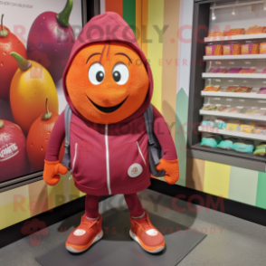 Maroon Grapefruit mascot costume character dressed with a Hoodie and Tote bags