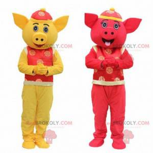 2 mascotte di maiali gialli e rossi, mascotte asiatiche -