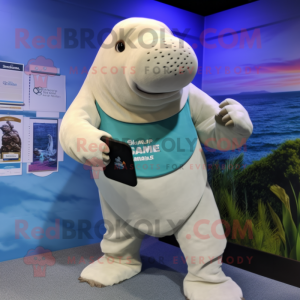 Cream Stellar'S Sea Cow mascot costume character dressed with a Board Shorts and Smartwatches