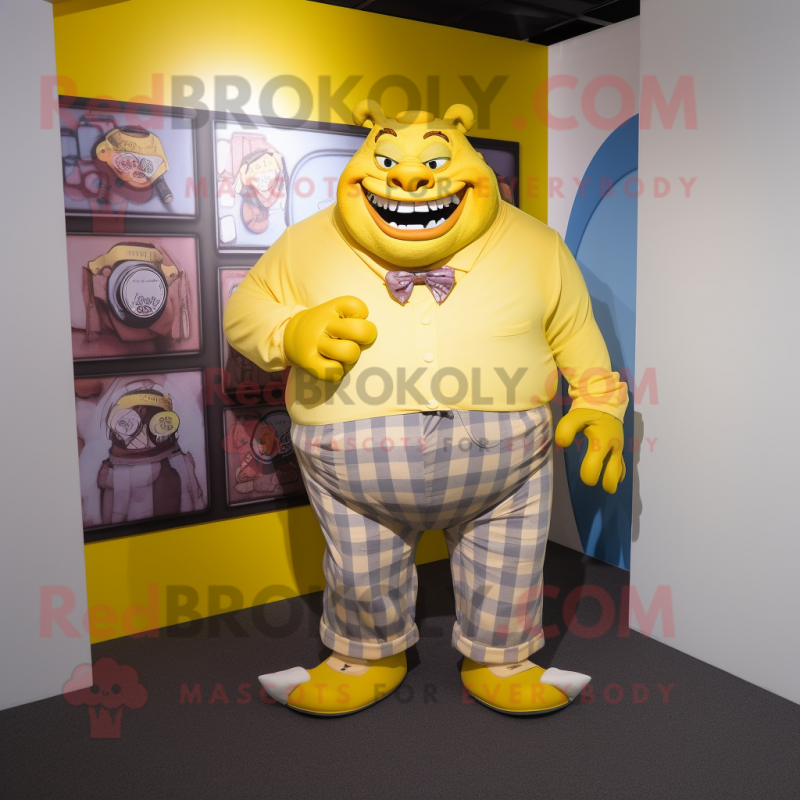 Yellow Ogre mascot costume character dressed with a Button-Up Shirt and Pocket squares Yellow Ogre mascot costume character dressed with a Button-Up Shirt and Pocket squares