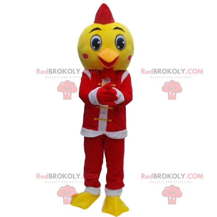 Żółty ptak maskotka przebrany za Świętego Mikołaja, świąteczny