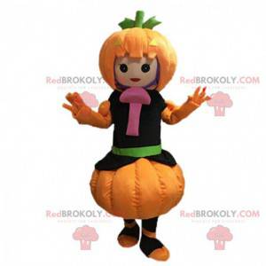 Mascot girl dressed as a pumpkin with a mushroom -
