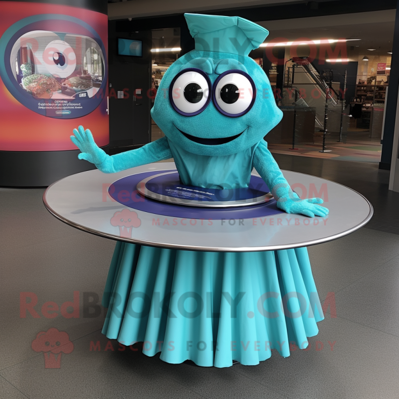 Teal Plate Spinner mascot costume character dressed with a Pleated Skirt and Rings Teal Plate Spinner mascot costume character dressed with a Pleated Skirt and Rings
