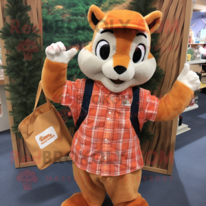 Orange Squirrel mascot costume character dressed with a Flannel Shirt and Tote bags