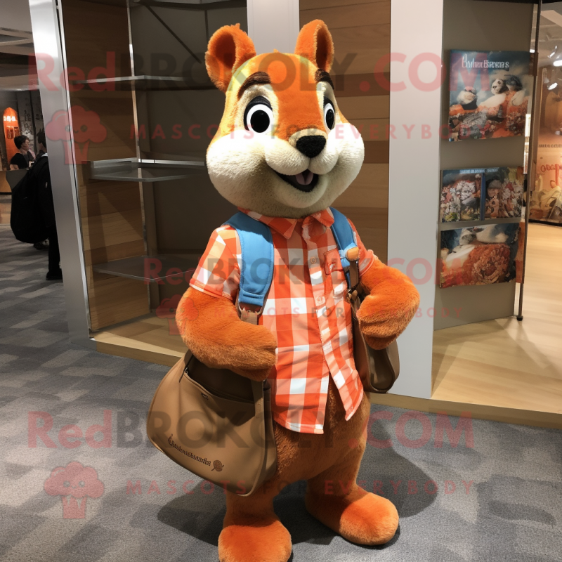 Orange Squirrel mascot costume character dressed with a Flannel Shirt and Tote bags