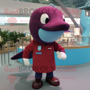 Maroon Blue Whale mascot costume character dressed with a Polo Shirt and Smartwatches