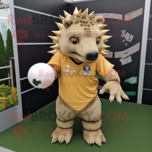 Tan Ankylosaurus mascot costume character dressed with a Rugby Shirt and Hair clips