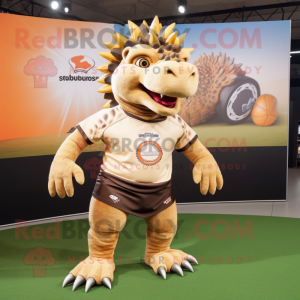 Tan Ankylosaurus mascot costume character dressed with a Rugby Shirt and Hair clips