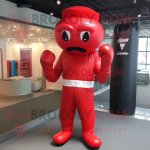 Red Boxing Glove mascot costume character dressed with a Empire Waist Dress and Caps