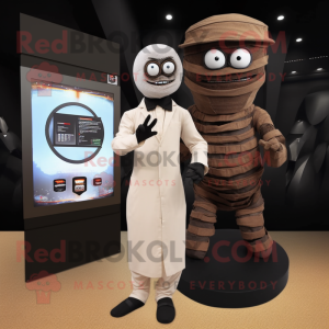 Brown Mummy mascot costume character dressed with a Tuxedo and Digital watches