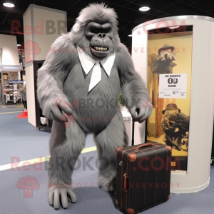 Gray Gorilla mascot costume character dressed with a Suit Pants and Briefcases