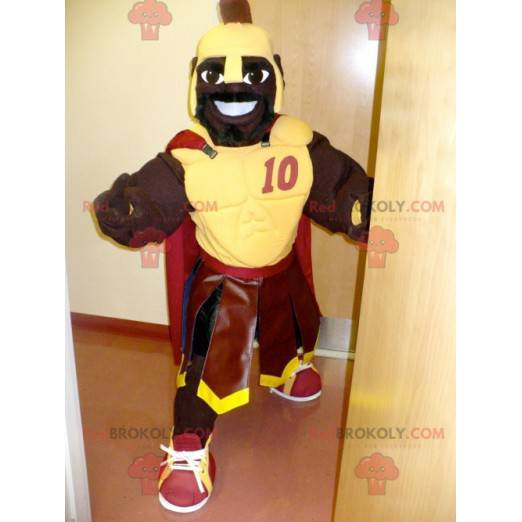 Mascotte gladiatore africano con armatura gialla -