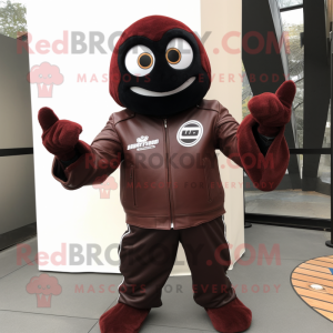 Maroon Shakshuka mascot costume character dressed with a Biker Jacket and Gloves