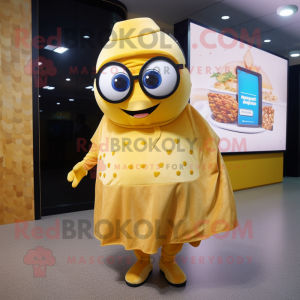 Gold Shakshuka mascot costume character dressed with a Dress and Eyeglasses