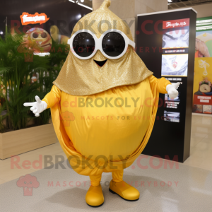 Gold Shakshuka mascot costume character dressed with a Dress and Eyeglasses