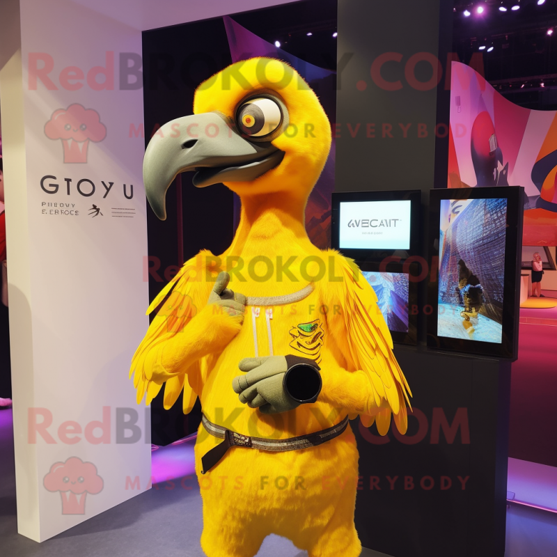 Yellow Vulture mascot costume character dressed with a Playsuit and Smartwatches Yellow Vulture mascot costume character dressed with a Playsuit and Smartwatches