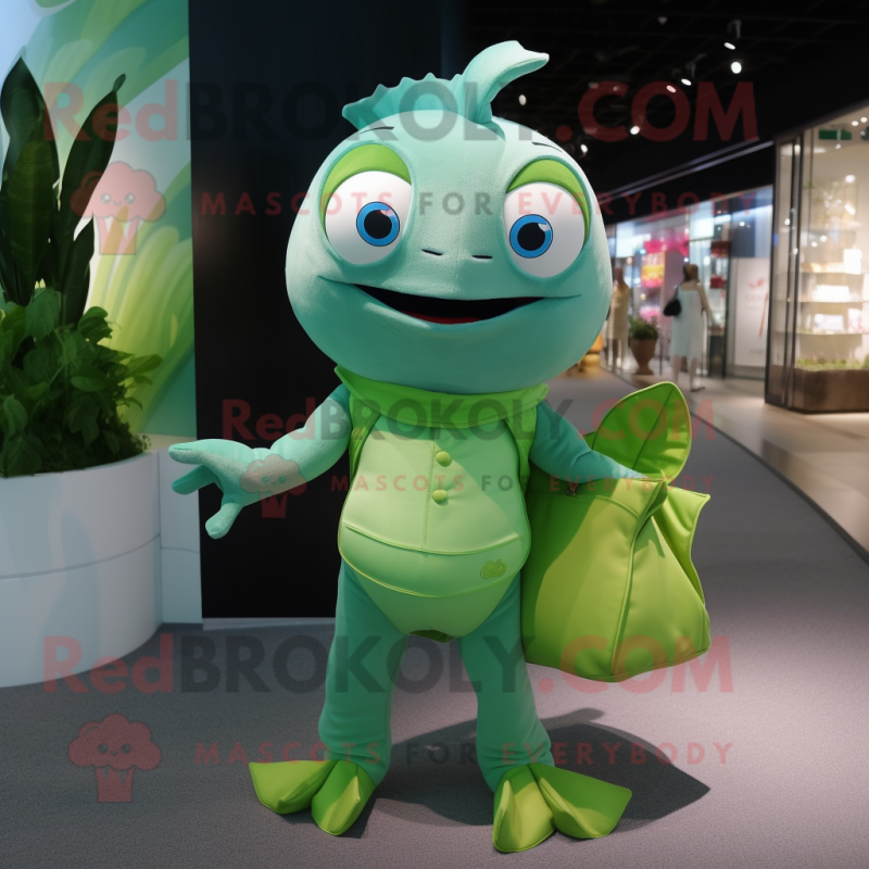 Green Goldfish mascot costume character dressed with a Chinos and Clutch bags