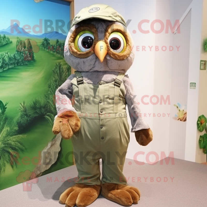 Olive Owl mascot costume character dressed with a Overalls and Rings