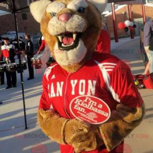 Mascotte de tigre marron et blanc en tenue de sport rouge -