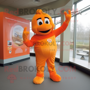 Orange Momentum mascot costume character dressed with a Suit Pants and Gloves