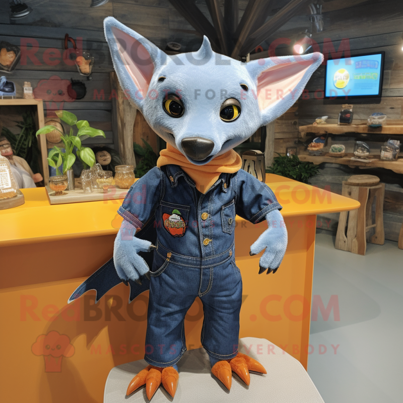 Orange Fruit Bat mascot costume character dressed with a Denim Shirt and Cufflinks